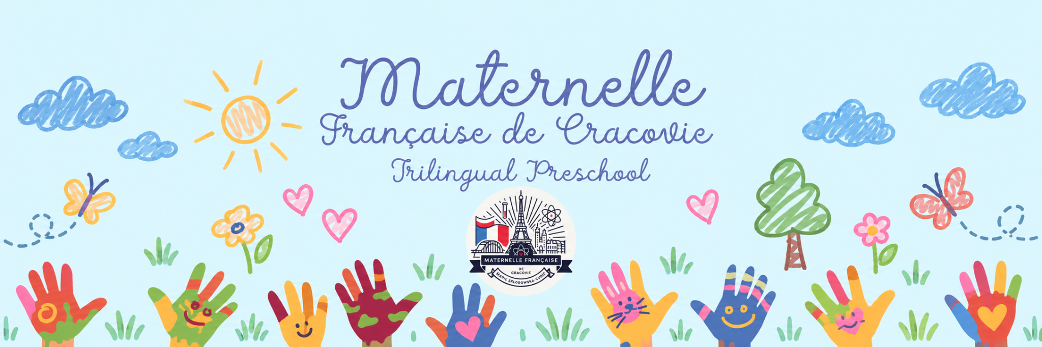Kolorowy baner trójjęzycznego przedszkola Maternelle Française de Cracovie z odciskami dziecięcych dłoni